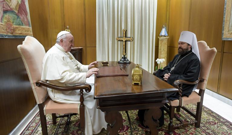This photo taken and handout on December 22, 2021 by The Vatican Media shows Pope Francis meeting (L) with Hilarion Alfeyev, bishop of the Russian Orthodox Church, the titular Metropolitan of Volokolamsk, the chairman of the Department of External Church Relations and a permanent member of the Holy Synod of the Patriarchate of Moscow, during a private audience in The Vatican. 