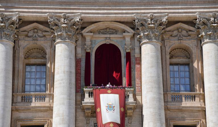 Pope Francis delivers the Easter "Urbi et Orbi" message from the balcony of St. Peter's Basilica overlooking St. Peter's square on April 17, 2022 in The Vatican. 