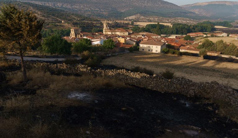 This photograph shows the Benedictine abbey, named "El Monasterio de Santo Domingo de Silos" after the wildfire in the Valle del Arlanza, in Santo Domingo de Silos near Burgos on July 25, 2022. The Spanish national weather office said the relentless heatwave since July 9 and the lack of rain since the start of the year across the Iberian Peninsula meant there was an "extreme" risk of fires. Since the beginning of the year, more than 200,000 hectares have already burned in Spain, according to the European Fo