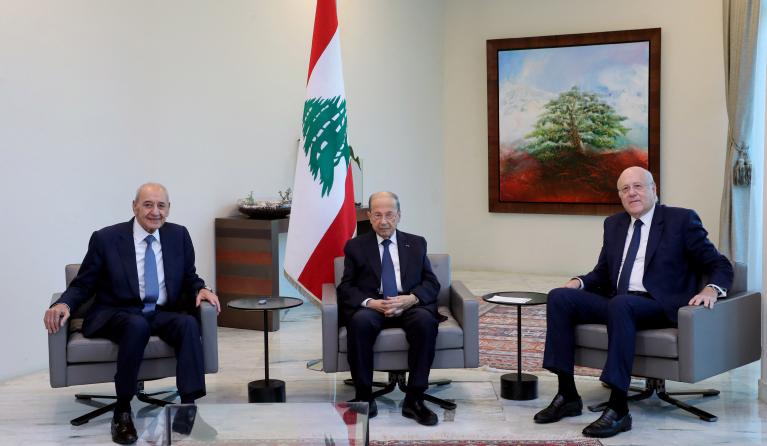 A handout picture provided by the Lebanese photo agency Dalati and Nohra on September 13, 2021 shows Lebanon's President Michel Aoun (C) meeting with Parliament Speaker Nabih Berri (L) and Prime Minister-designate Najib Mikati at the presidential palace in Baabda, east of the capital Beirut. Lebanese commentators voiced scepticism over the bankrupt state's ability to win back the support of foreign donors after political factions finally agreed a new government following 13 months of horse-trading.