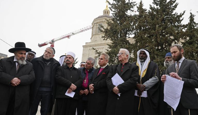 Christian, Jewish and Muslim religious leaders gather in Jerusalem’s Moscow Square to call for peace in Ukraine, on March 21, 2022. 