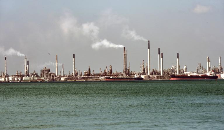 Smokes rises out of chimneys from a Shell oil refinery on Pulau Bukom