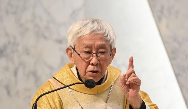 Retired Cardinal Joseph Zen, one of Asia's highest ranking Catholic clerics, attends mass at the Holy Cross Church in Hong Kong on May 24, 2022. The ninety-year-old retired Catholic cardinal appeared in a Hong Kong court on May 24 charged with failing to properly register a protest defence fund, after he was initially arrested under the city's national security law.  Peter PARKS / AFP