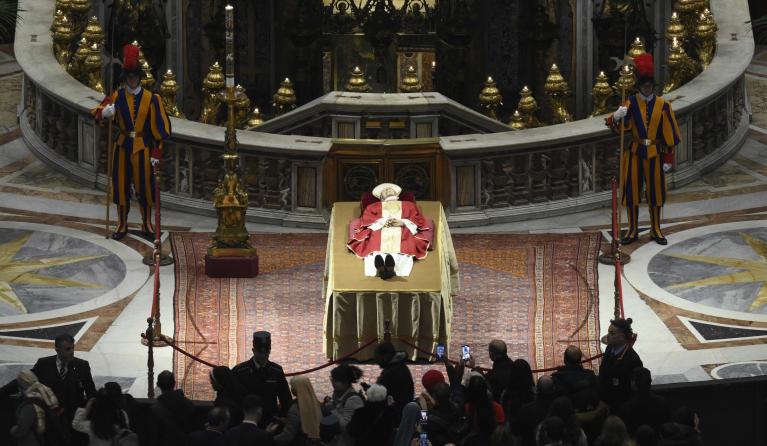 A handout photo made available by Vatican Media shows faithful paying their respects to Pope Emeritus Benedict XVI (Joseph Ratzinger) whose body lies in state in the Saint Peter's Basilica for public viewing, Vatican City, 02 January 2023. Former Pope Benedict XVI died on 31 December at his Vatican residence, aged 95. For three days, starting from 02 January, the body will lay in state in St Peter's Basilica until the funeral on 05 January. EPA/VATICAN MEDIA HANDOUT EDITORIAL USE ONLY/NO SALES