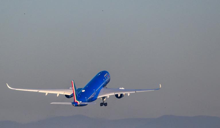 An Airbus A350-900 bearing the ITA Airways livery takes off on January 31, 2023 from Rome's Fiumicino airport, transporting the Pope heading to Democratic Republic of Congo and South Sudan. Pope Francis heads to Democratic Republic of Congo and South Sudan, delivering a message of peace and reconciliation to two sub-Saharan African nations plagued by conflict. The pontiff flies to the Congolese capital Kinshasa on January 31 before heading on Friday to Juba, the capital of South Sudan where he will be joine