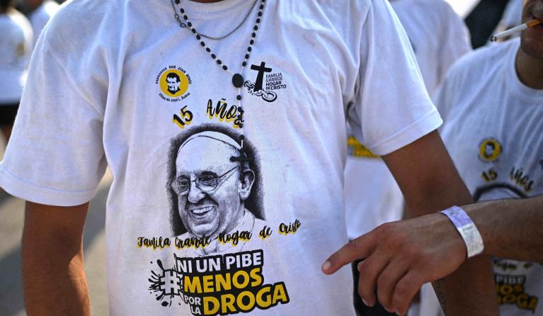 Faithfuls march towards the Basilica of Lujan on March 11, 2023, in Lujan, Buenos Aires province, to participate in a mass to celebrate 15 years of the Familia Grande Hogar de Cristo organization that works to rehabilitate drug addicts and marking the 10th anniversary of Pope Francis proclamation. Pope Francis marks 10 years as head of the Catholic Church on Monday, hugely popular but facing internal dissent after a decade of reform, even if he has not questioned basic doctrine. Luis ROBAYO / AFP