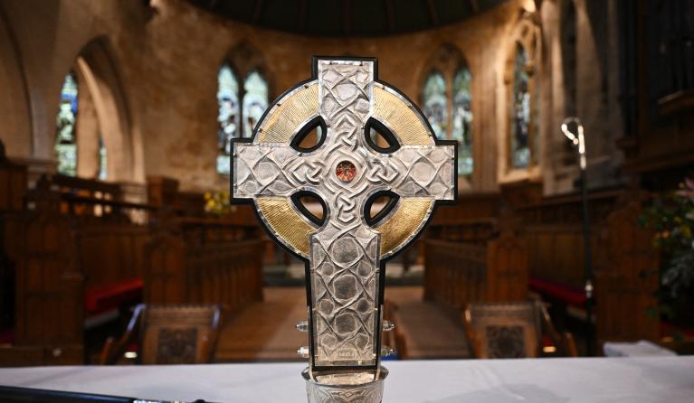 'The Cross of Wales' is displayed for a photograph ahead of a ceremony to bless the Cross at Holy Trinity Church in Llandudno, north Wales, on April 19, 2023. The Cross of Wales, a new processional cross presented by King Charles III as a centenary gift to the Church in Wales, is set to be used to lead the King's Coronation procession at Westminster Abbey on 6 May. The Cross will incorporate a relic of the True Cross, the personal gift to the King from Pope Francis. Paul ELLIS / AFP