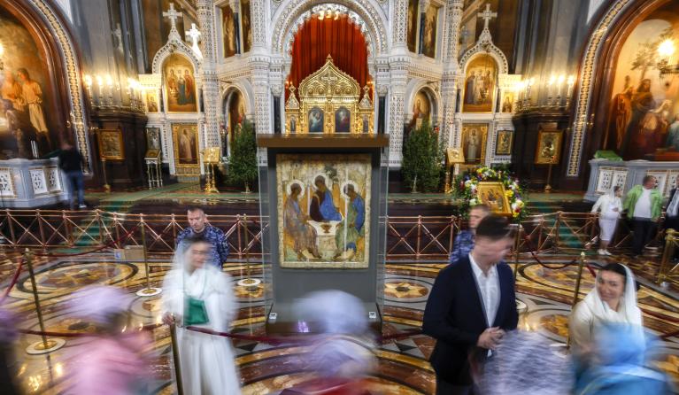 Russian Orthodox believers worship the icon 'Trinity' by Andrei Rublev during a church service on Holy Trinity in the Cathedral of Christ the Savior in Moscow, Russia, 04 June 2023. On 15 May, it became known about the decision to transfer the icon 'Trinity' by Andrei Rublev from the Tretyakov Gallery to the Russian Orthodox Church. According to the message, which was published on the website of the Russian Orthodox Church, the decision was made by the Russian president 'in response to numerous requests fro