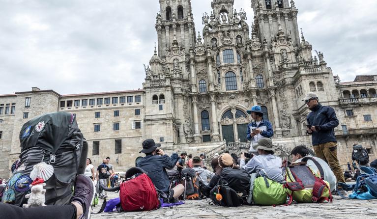 People gather at the end of their pilgrimage in the Obradoiro Plaza, in front of the Santiago de Compostela’s Cathedral, in Santiago de Compostela, Galicia, Spain, 12 June 2023. The St James Way, also known as the ‘Way of Saint James’ is one of the most ancient and popular pilgrimage routes in the world since the XI century. Often referred to as the Camino de Santiago, this Way takes pilgrims through many different routes across Spain, France and Portugal and culminates in the city of Santiago de Compostela