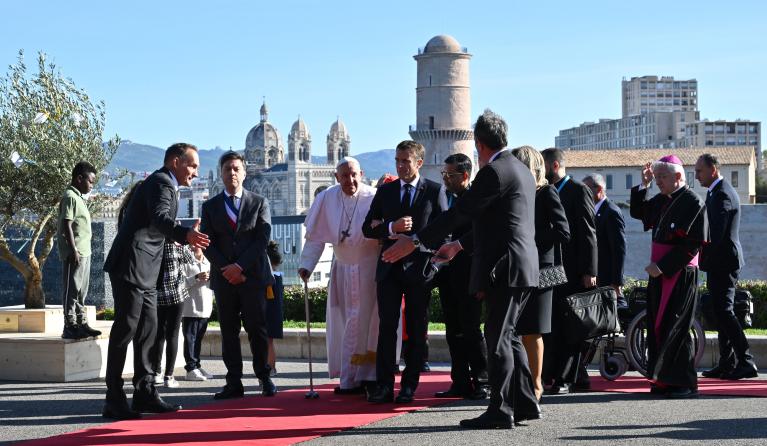 Pope Francis (3rd L) is greeted by French President Emmanuel Macron and his wife Brigitte, upon his arrival at the Palais du Pharo in the southern port city of Marseille on September 23, 2023.