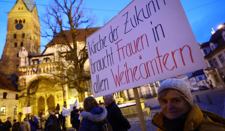 Banner reads 'the church of the future needs women in all ordained ministries', as people protest for reform in the Catholic Church before the opening service at the Spring General Assembly of the German Bishops' Conference in Augsburg (Deutsche Bischofskonferenz) in Augsburg, Germany, 19 February 2024. German bishops gather in Augsburg for their annual spring general assembly which takes place this year from 19 to 22 February 2024. EPA/ANNA SZILAGYI