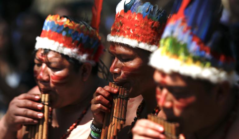 Indigenous people from Colombia's Amazon Region perform with traditional instruments during the inauguration of the COP16 Green Zone in Cali, Colombia, 21 October 2024. The Colombian government has installed a Green Zone in the center of Cali with a view to giving prominence to civil society, and especially to indigenous peoples, Afro-descendant communities and farmers. The 16th Conference of the Parties (COP16) to the United Nations' Convention on Biological Diversity is held under the motto 'Peace with na