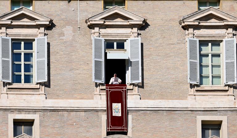 Pope Francis addresses the crowd from the window of the apostolic palace overlooking St.Peter's square during his Sunday Angelus prayer at the Vatican on December 1, 2024. Alberto PIZZOLI / AFP