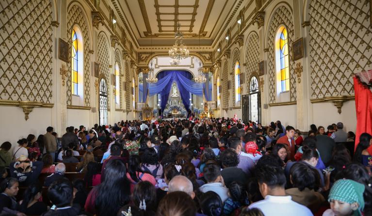 People visit the Sanctuary of Guadalupe located in the center of Guatemala City, Guatemala, 12 December 2024. With floral offerings and prayers, the devotees are accompanied by their children to commemorate the Day of the Virgin of Guadalupe to whom they attribute numerous miracles. EPA/Mariano Macz