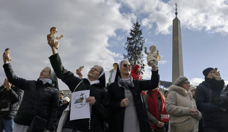 Nuns and faithfuls hold figurines of baby Jesus as Pope Francis leads his Sunday Angelus prayer from Santa Marta Chapel in Saint Peter's Square, Vatican City, 22 December 2024. EPA/Riccardo Antimiani