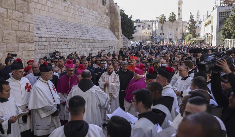 Latin Patriarch of Jerusalem Pierbattista Pizzaballa (C) leads the yearly Christmas procession outside the Church of the Nativity in Bethlehem town in the Israel-occupied West Bank on December 24, 2024. HAZEM BADER / AFP