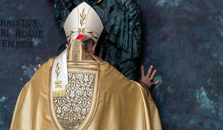 Italian Cardinal Baldassare Reina opens a Holy Door at St John in Lateran basilica in the Vatican on December 29, 2024, as part of the Catholic Jubilee Year. Angelo CARCONI - AFP