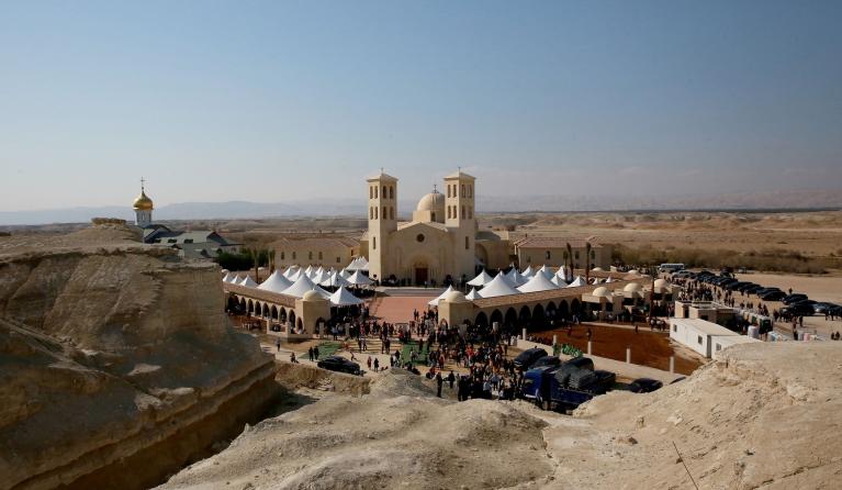 People arrive to attend mass for the dedication and inauguration of the Church of the Baptism of the Lord at Al-Maghtas, also known as the Baptism Site 'Bethany Beyond the Jordan', around 50Km west of Amman on the eastern bank of the Jordan River on January 10, 2025. Khalil MAZRAAWI / AFP