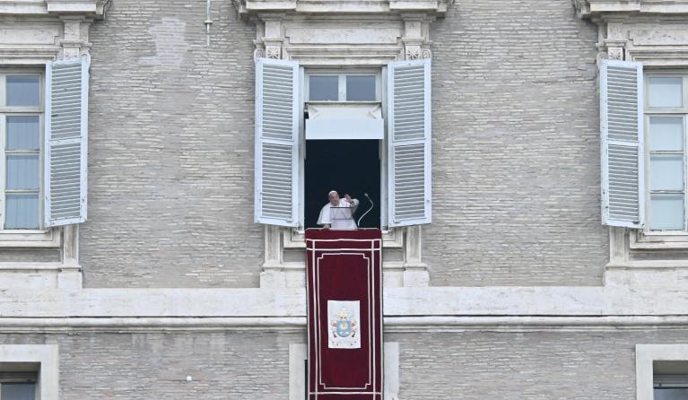 Pope Francis waves from the window of the apostolic palace overlooking St. Peter's square for the Angelus prayer on January 19, 2025 in The Vatican. Filippo MONTEFORTE / AFP
