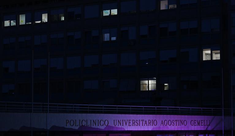 A picture taken at night shows the Gemelli hospital where Pope Francis is hospitalized for pneumonia, in Rome on February 23, 2025. Pope Francis's condition "remains critical" but the 88-year-old has not had another respiratory attack, the Vatican said on February 23, 2025 in the evening update.