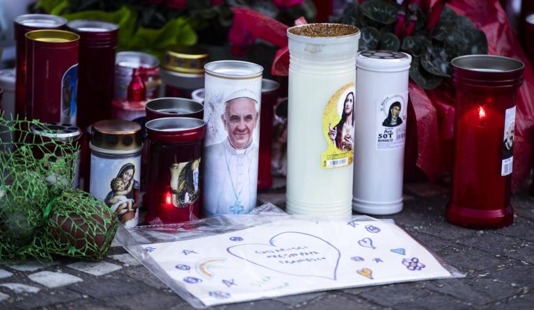 Candles are placed under the statue of John Paul II at the entrance to the Gemelli Hospital, where Pope Francis is hospitalized, in Rome, Italy, 05 March 2025. Pope Francis was admitted to the Agostino Gemelli Hospital in Rome on February 14 due to a respiratory tract infection. EPA/ANGELO CARCONI