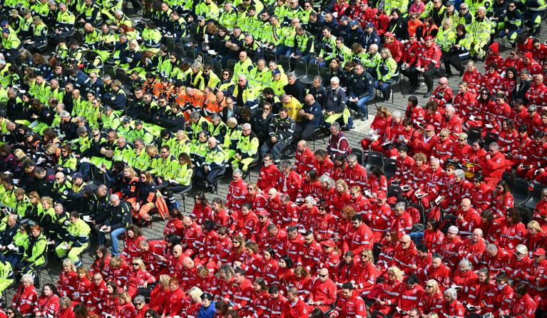 Volunteers of the Red Cross and the Civil Protection attend a mass for the Jubilee of the World of Volunteering at St Peter's square in The Vatican, on March 09, 2025. Pope Francis passed a quiet night in hospital, the Vatican said on March 9, 2025, after revealing that the 88-year-old was responding well to treatment for pneumonia. Alberto PIZZOLI / AFP