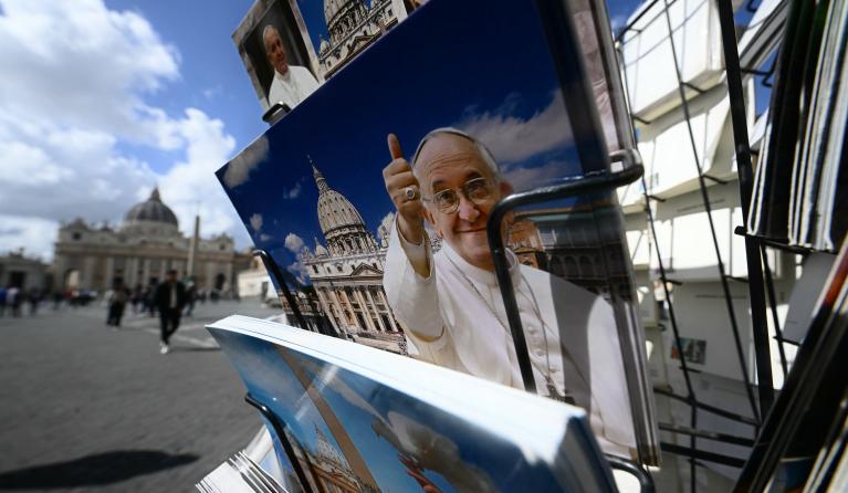 Postcards of Pope Francis are on sale near St Peter's square in the Vatican as he is still hospitalized with pneumonia, on March 16, 2025. Pope Francis said on March 16, 2025 he was fragile and "facing a period of trial", as he thanked well-wishers for prayers in a message from hospital, where he is slowly recovering from pneumonia. Filippo MONTEFORTE / AFP