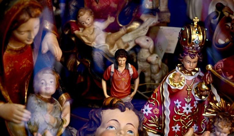 Figurines of Blessed Carlo Acutis, an adolescent who spent his life spreading his faith online, earning the moniker "God's Influencer", are on sale in a souvenirs shop in Assisi where Acutis is on display, on April 3, 2025. Blessed Carlo Acutis, the world's first millennial saint who died in 2006 aged 15, will be canonized by Pope Francis on April 27, 2025 in The Vatican. Tiziana FABI / AFP