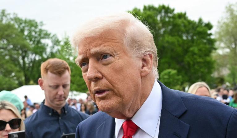 US President Donald Trump walks by guests as he attends the annual Easter Egg Roll on the South Lawn of the White House on April 21, 2025, in Washington, DC. According to the US National Park Service, the egg roll tradition dates back to 1878 when President Rutherford B. Hayes invited children to roll Easter eggs on the White House grounds. Children previously rolled eggs down a hill at the US Capitol in the early 1870s, but a law was passed in 1876 forbidding the Capitol property from being used due to the