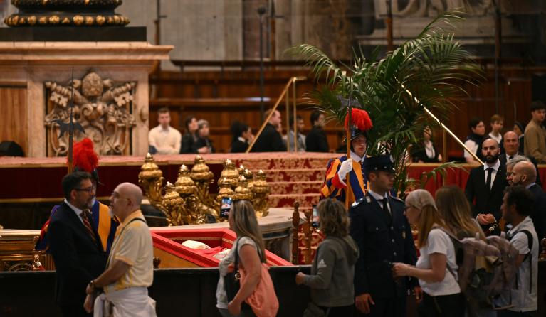 Visitors, pilgrims and the faithful pay respects to late Pope Francis inside St Peter’s Basilica in The Vatican, on April 23, 2025. Tens of thousands of mourners began saying their last goodbyes to Pope Francis at St Peter's Basilica on April 23, 2025 as the body of the late Argentine pontiff began three days of lying in state. Andrej ISAKOVIC / AFP