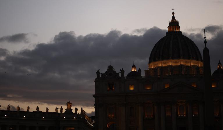 This photograph shows the St Peter's Basilica of the Vatican at dusk, in the Vatican on April 25, 2025.
