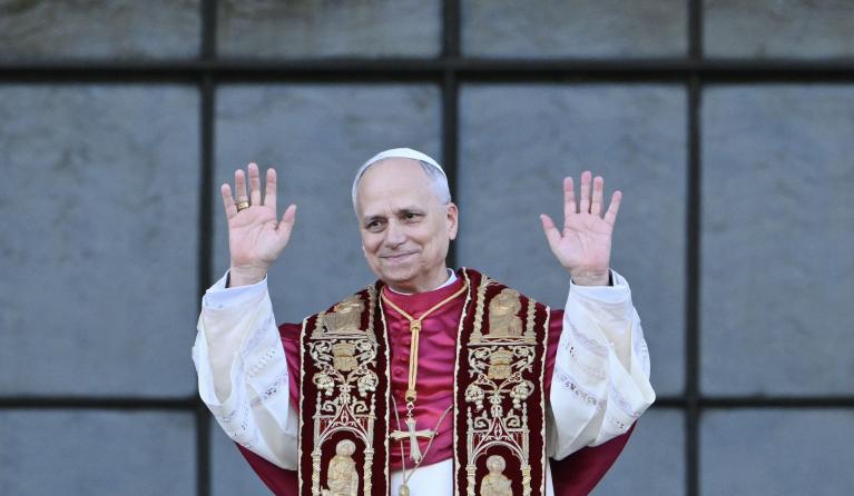 Pope Leo XIV waves to the crowd from the main central balcony of Saint John Lateran archbasilica after a holy mass in Rome, on May 25, 2025. Alberto PIZZOLI / AFP