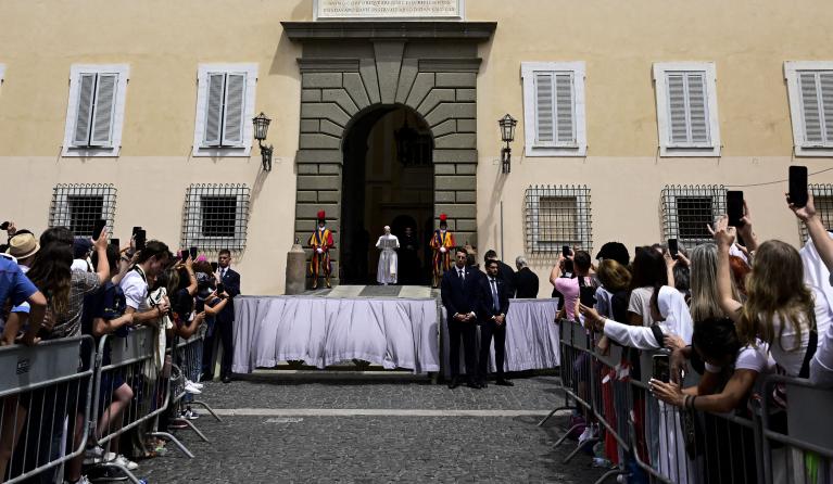 Pope Leo XIV addresses the crowd for the Angelus prayer in Piazza della Liberta (Liberty Square) in front of Palazzo Apostolico (Apostolic Palace) in the summer papal estate in Castel Gandolfo, 40 km southeast of Rome, on July 13, 2025. The newly elected Pope Leo XIV, takes a summer break from July 6 to 20 at the papal palace at Castel Gandolfo, outside Rome, a longtime country residence for pontiffs that Francis declined to use. Tiziana FABI / POOL / AFP