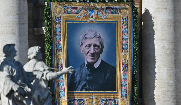 A portrait of Saint John Henry Newman is hanged on St Peter's basilica during the Solemnity of All Saints with the Rite of Proclamation of Saint John Henry Newman as a "Doctor of the Church" on the occasion of the Jubilee of the World Education on All Saints' Day at St. Peter's square, in The Vatican on November 1, 2025. Andreas SOLARO / AFP