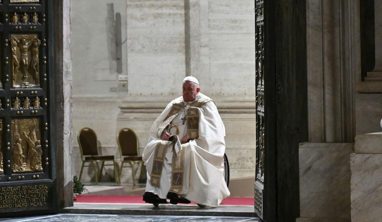 Pope Francis opens the Holy Door of St Peter's Basilica in the Vatican to mark the start of the Catholic Jubilee Year, on December 24, 2024.