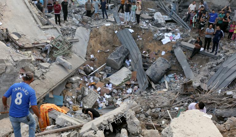 Palestinians search the destroyed annex of the Greek Orthodox Saint Porphyrius Church, the oldest church still in use in Gaza, damaged in a strike on Gaza City on October 20, 2023, amid the ongoing battles between Israel and the Palestinian group Hamas. Thousands of people, both Israeli and Palestinians have died since October 7, 2023, after Palestinian Hamas militants based in the Gaza Strip, entered southern Israel in a surprise attack leading Israel to declare war on Hamas in Gaza on October 8.  Dawood N