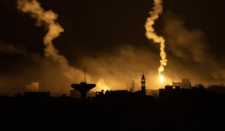 This picture taken from a position near Sderot along the Israeli border with the Gaza Strip early on November 13, 2023, shows flares dropped by Israeli forces above the Palestinian enclave amid ongoing battles between Israel and the Palestinian Hamas movement.  FADEL SENNA / AFP