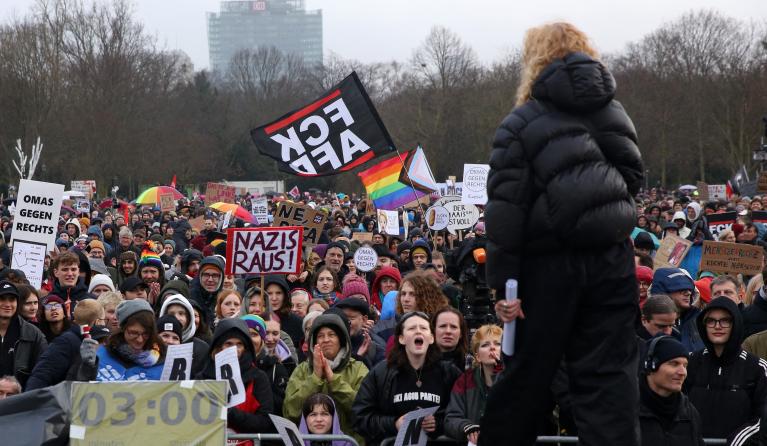 Demonstrators protest against the far-right Alternative for Germany (AfD) party outside the Reichstag building in Berlin, Germany on February 3, 2024, during a rally under the motto 'We are the firewall' called for by international non-profit organisation 'Hand in Hand' to protest against right-wing politics. Thousands of protesters gathered outside the Reichstag building in central Berlin to demonstrate against racism and the far right, with many more peaceful rallies planned across the country. Adam BERRY