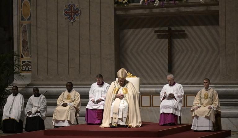 Pope Francis presides the Easter vigil as part of the Holy Week celebrations, at St Peter's Basilica in the Vatican on March 30, 2024. Tiziana FABI / AFP