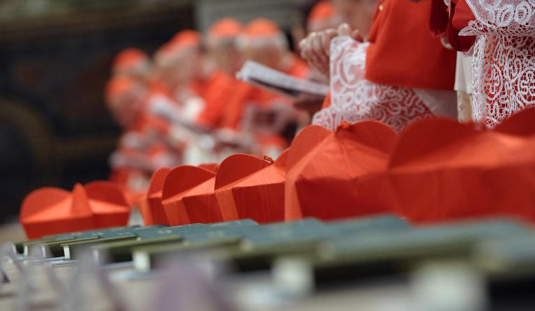 This handout picture released by the Press office shows cardinals' hats in the Sistine Chapel before the start of the conclave at the Vatican on March 12, 2013. 