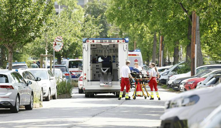 Rescue paramedics are seen next to an ambulance car close to a school where, according to reports, several people died in a shooting, on June 10, 2025 in Graz, southeastern Austria. Several people died in a school shooting, including the attacker, Austrian broadcaster ORF quoted the interior ministry as saying. ERWIN SCHERIAU / APA / AFP