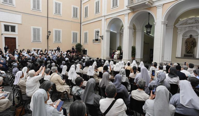 A handout photo made available by Vatican Media shows Pope Leo XIV (C-rear) in the courtyard of the Apostolic Palace of Castel Gandolfo, Italy, 12 July 2025, while attending the General Chapters of various religious institutes. EPA/Vatican Media