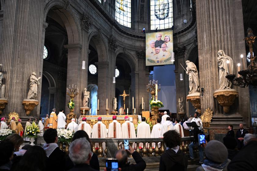 A congregation attends a beatification ceremony for five martyred priests (pictured on a poster, seen top) executed in Paris amid the Paris Commune's "Bloody Week" battle in 1871, held at the Saint-Sulpice Church in Paris, on April 22, 2023. bERTRAND GUAY / AFP A congregation attends a beatification ceremony for five martyred priests (pictured on a poster, seen top) executed in Paris amid the Paris Commune's "Bloody Week" battle in 1871, held at the Saint-Sulpice Church in Paris, on April 22, 2023. bERTRAND GUAY / AFP