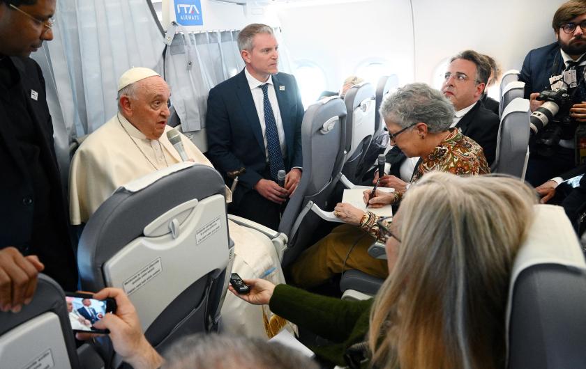 Pope Francis speaks to journalists during the flight from Budapest to Italy on April 30, 2023, after his second visit to Hungary in less than two years. The Pope met refugees, believers, students, church and state leaders during his tree-day trip and celebrates a holy mass in front of the parliament building, at the Kossuth Square of Budapest on April 30, 2023 morning. Vincenzo PINTO / POOL / AFP Pope Francis speaks to journalists during the flight from Budapest to Italy on April 30, 2023, after his second visit to Hungary in less than two years. The Pope met refugees, believers, students, church and state leaders during his tree-day trip and celebrates a holy mass in front of the parliament building, at the Kossuth Square of Budapest on April 30, 2023 morning. Vincenzo PINTO / POOL / AFP