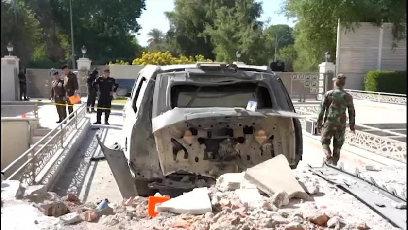 This image grab taken from footage released by the Iraqi Prime Minister's press office on November 7, 2021 shows security forces near a damaged vehicle inspecting the aftermath of a drone strike on the prime minister's residence which took place earlier the same day. Iraqi Prime Minister Mustafa al-Kadhemi escaped unhurt from an "assassination attempt" in which an explosives-packed drone hit his Baghdad residence early on November 7, a new escalation in the country's post-election turmoil. IRAQI PRIME MINISTER'S PRESS OFFICE This image grab taken from footage released by the Iraqi Prime Minister's press office on November 7, 2021 shows security forces near a damaged vehicle inspecting the aftermath of a drone strike on the prime minister's residence which took place earlier the same day. Iraqi Prime Minister Mustafa al-Kadhemi escaped unhurt from an "assassination attempt" in which an explosives-packed drone hit his Baghdad residence early on November 7, a new escalation in the country's post-election turmoil.