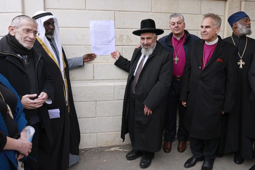 Christian, Jewish and Muslim religious leaders gather in Jerusalem’s Moscow Square to call for peace in Ukraine, on March 21, 2022. Menahem KAHANA / AFP Christian, Jewish and Muslim religious leaders gather in Jerusalem’s Moscow Square to call for peace in Ukraine, on March 21, 2022.