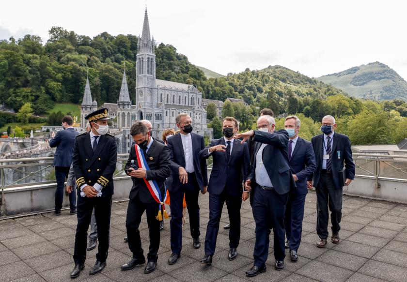 French President Emmanuel Macron arrives for a visit at the Catholic sanctuary of Notre Dame de Lourdes, southwestern France, on July 16, 2021. Macron is on a two-day visit in southwestern France, notably to attend stages of the 108th edition of the Tour de France cycling race. Ludovic MARIN / AFP French President Emmanuel Macron arrives for a visit at the Catholic sanctuary of Notre Dame de Lourdes, southwestern France, on July 16, 2021. Macron is on a two-day visit in southwestern France