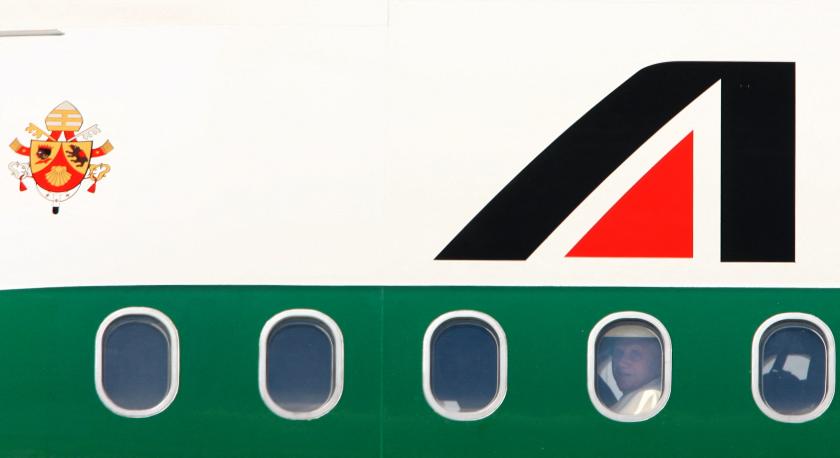 Pope Benedict XVI looks out of the window on board Alitalia flight after landing at the International Airport of Okecie in Warsaw, 25 May 2006. The Pontiff arrives Thursday in Warsaw for a four-day visit in Poland that will take him to key places in the life and papacy of his predecessor, John Paul II, as well as to the former Nazi death camp at Auschwitz-Birkenau. AFP PHOTO/ VINCENZO PINTO VINCENZO PINTO / AFP Pope Benedict XVI looks out of the window on board Alitalia flight after landing at the International Airport of Okecie in Warsaw, 25 May 2006. The Pontiff arrives Thursday in Warsaw for a four-day visit in Poland that will take him to key places in the life and papacy of his predecessor, John Paul II, as well as to the former Nazi death camp at Auschwitz-Birkenau. AFP PHOTO/ VINCENZO PINTO VINCENZO PINTO / AFP