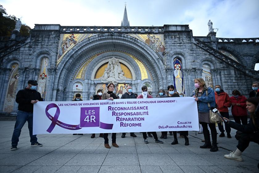 'From words to action' collective members hold a banner reading 'Victims of sexual violence in the Catholic Church demand: recognition, responsibility, reparation, reform' as they take part in a rally on the forecourt of the Notre-Dame-du-Rosaire basilica, in Lourdes, south-western France on November 6, 2021. The annual meeting of bishops began on November 2, 2021 in Lourdes where they have a week to reflect on the follow-up to be given to the revelations of the Sauve report, a month after its publication, on the extent of child crime in the Catholic Church. Valentine CHAPUIS / AFP 'From words to action' collective members hold a banner reading 'Victims of sexual violence in the Catholic Church demand: recognition, responsibility, reparation, reform' as they take part in a rally on the forecourt of the Notre-Dame-du-Rosaire basilica, in Lourdes, south-western France on November 6, 2021. The annual meeting of bishops began on November 2, 2021 in Lourdes where they have a week to reflect on the follow-up to be given to the revelations of the Sauve report, a month after its publication,