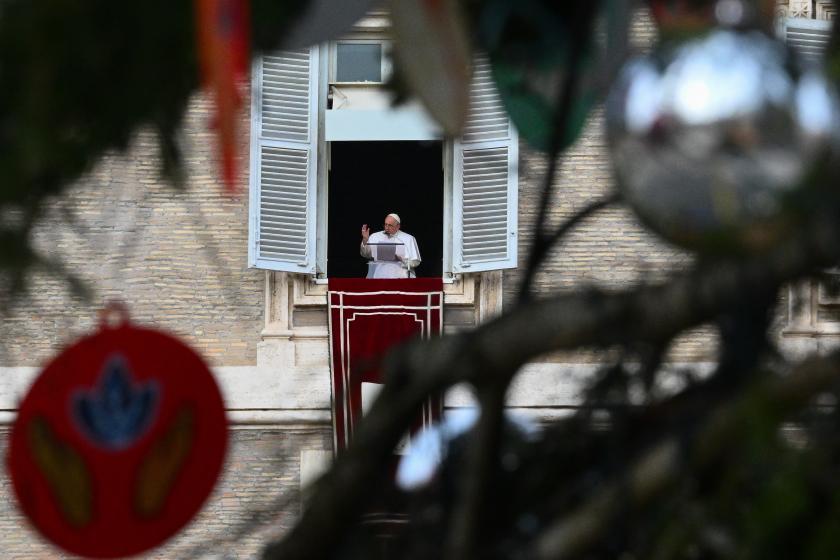 Pope Francis speaks from the window of the apostolic palace as he celebrates the Solemnity of the Immaculate Conception with the midday recitation of the Angelus, on December 8, 2022 in The Vatican.  Vincenzo PINTO / AFP